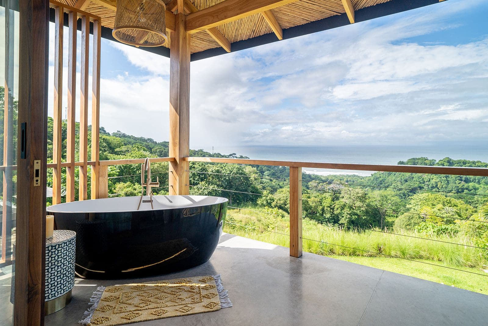 An open-air bath overlooking the jungle and the Pacific